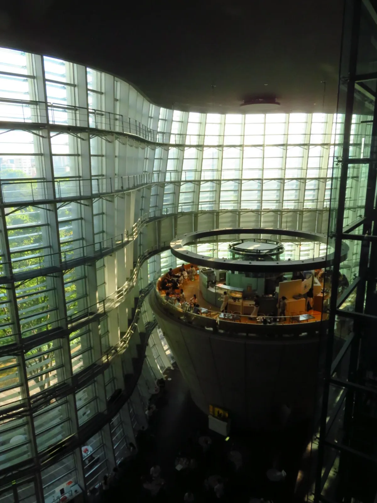 Glass atrium wrapped around a cone-shaped building